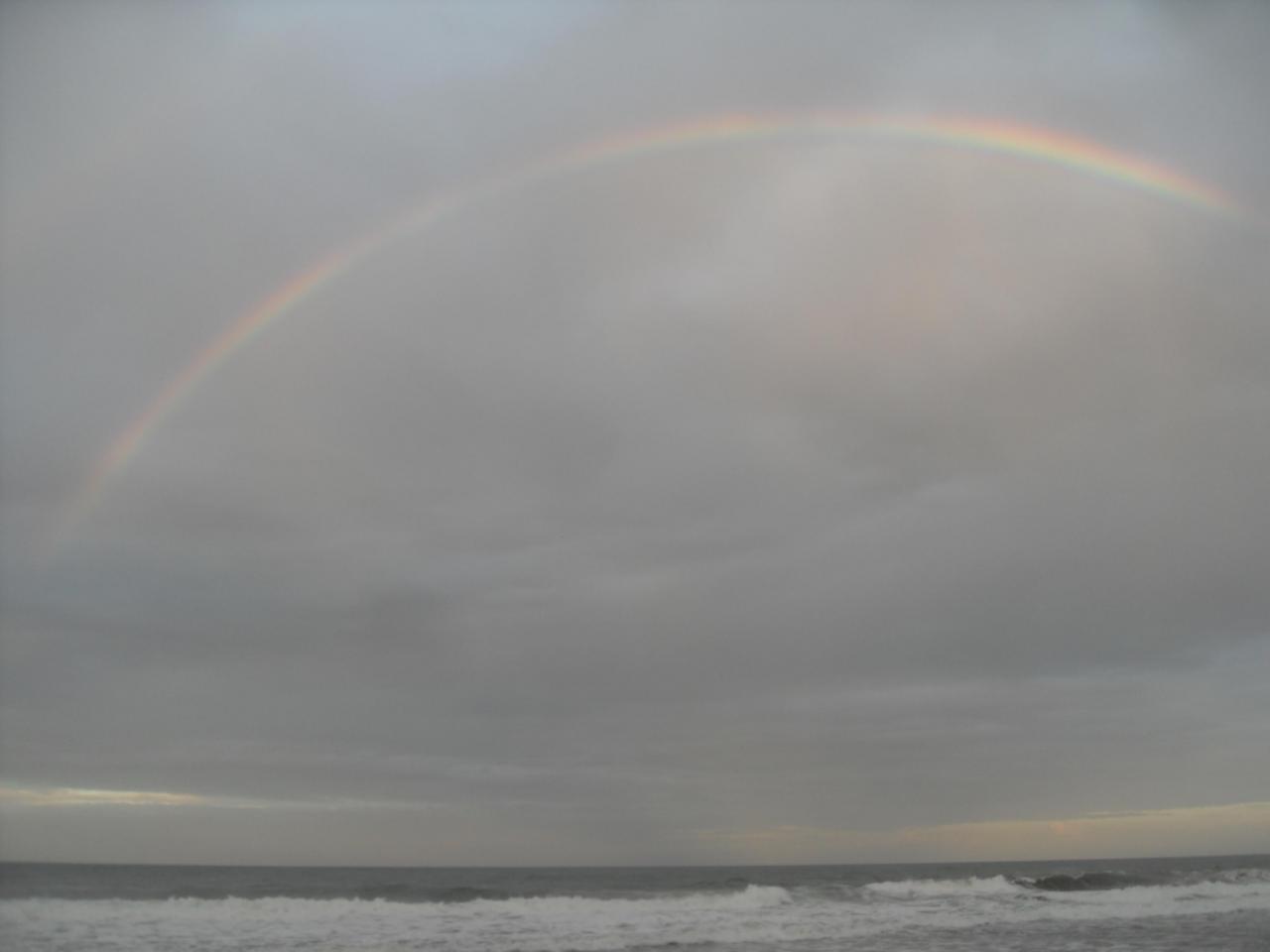 Rainbow over beach at Playa Cocles, Puerto Viego